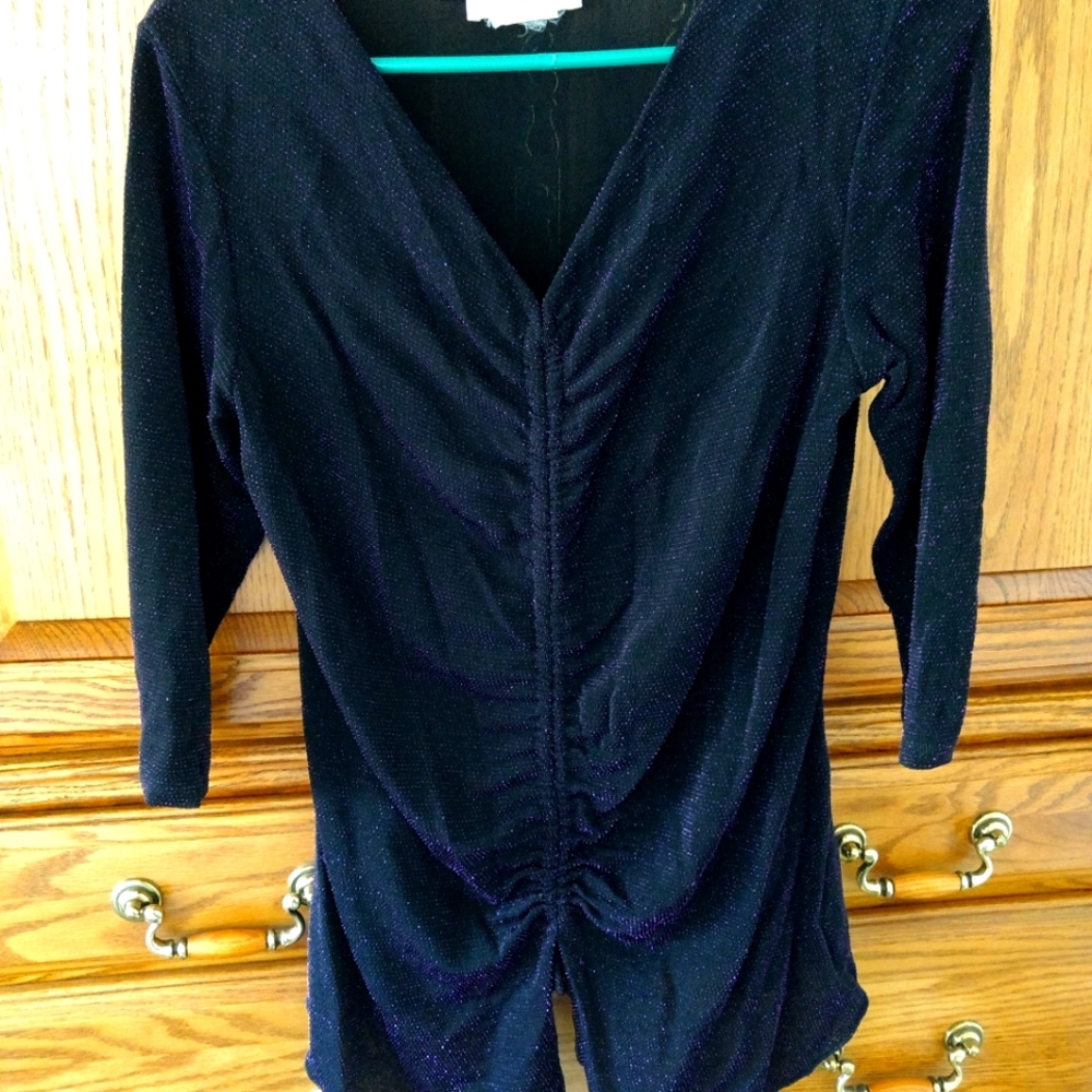 Dressy sparkling top that is a size 12. Brand Tradition